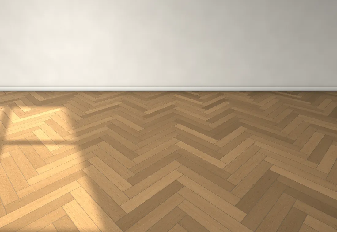 An empty room with a light oak herringbone floor and warm grey grout